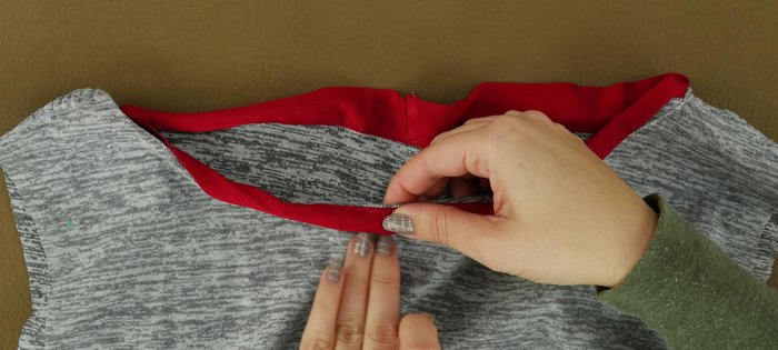 For hemming, pink the raw edge, fold, and hand- or machine-blind stitch, or use a twin needle for stretch.