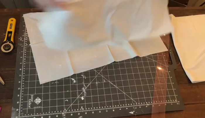 Comb through the cut strips to separate them. Unfold the piece completely, being careful not to pull too hard.