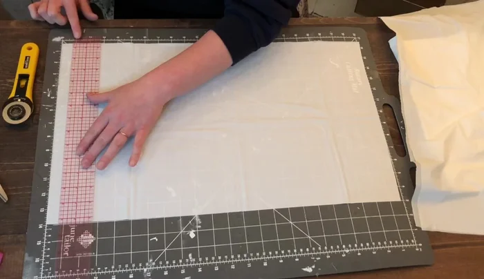 Comb through the cut strips to separate them. Unfold the piece completely, being careful not to pull too hard.