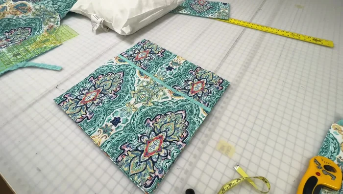 Find center points: Mark the center point on each side of the square and the closure pieces.