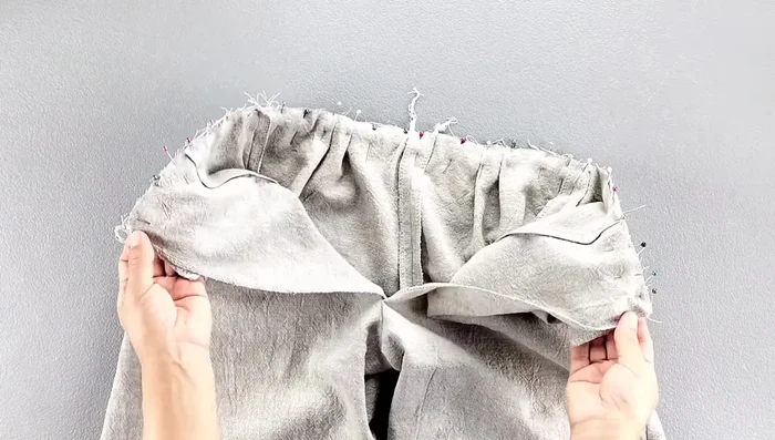 Press the waistband seam down.