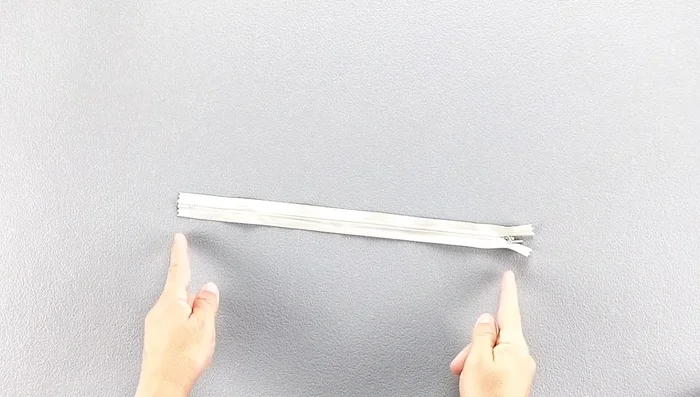 Turn the pants inside out and close the zipper to align both sides.