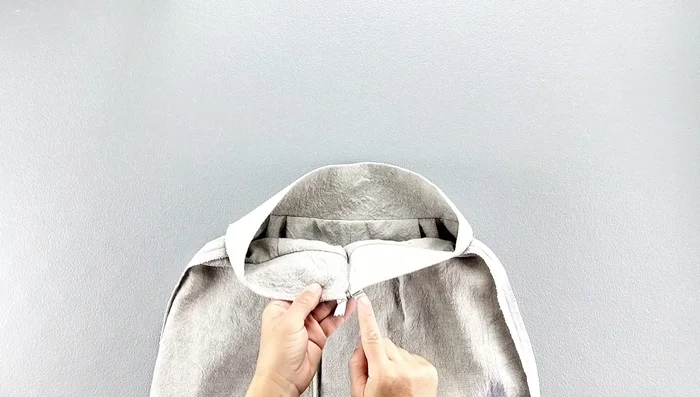 Fold and sew the zipper tape to the inside of the waistband.