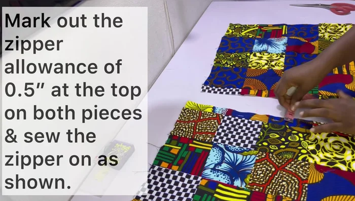 Mark zipper allowance (0.5 inch) on both fabric pieces. Install the zipper (refer to linked video for instructions).