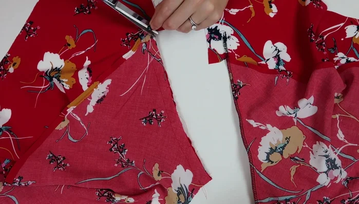 Serge and seam finish the sleeve seams.