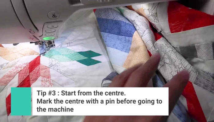 Begin quilting from the center, especially if working with a medallion quilt. If it's not a medallion, find and mark the center.