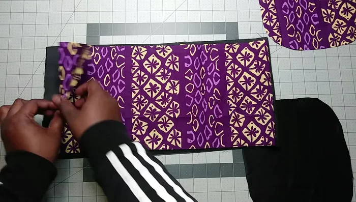 Sew the fabric pieces: Pin the right sides of the fabric together and sew along the edges. Then, sew the two layers together, leaving a gap for elastic insertion.