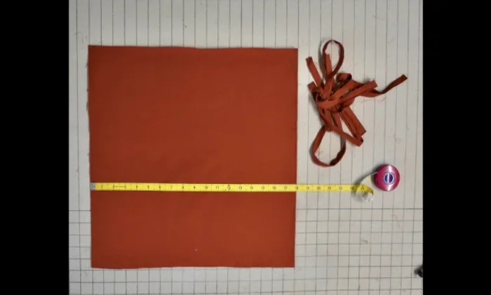 Cut your fabric to the correct size for the finished pillow cover (e.g., 17 inches for an 18-inch pillow form).