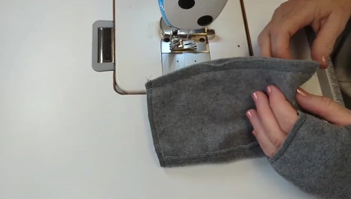 Sew a regular seam (3/8 inch or 1 cm) on each side of the glove. Try the gloves on to determine the desired hem depth.