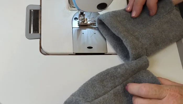 Sew the two bottom edges together using a regular seam width. Top stitch just above the seam to hide it.