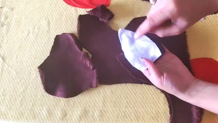 Attach the ears to the face.