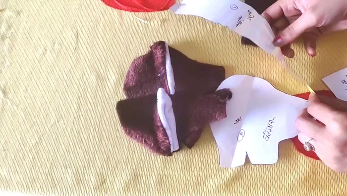 Attach the ears to the face.