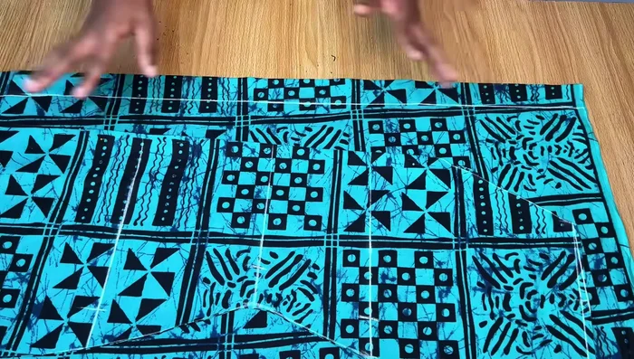 Cut the Back Pattern: Trace the front pattern onto the back, adjusting the neckline. Cut out the back pattern, separating it into two pieces.