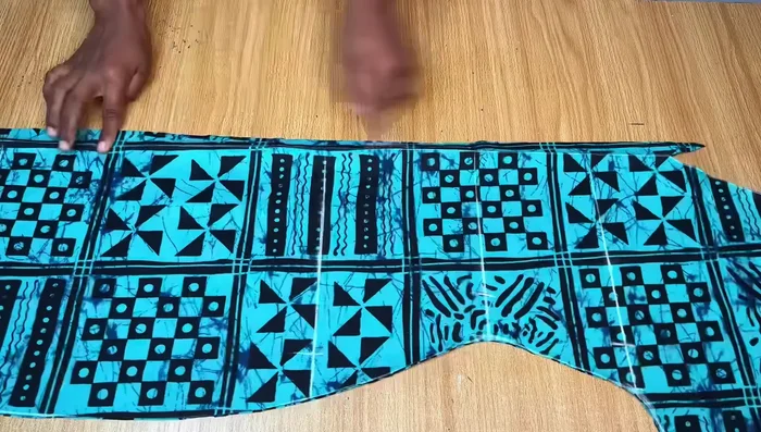 Apply Bias Tape to the Neckline: Stitch bias tape around the neckline, creating a neat and finished edge. Stitch both sides of the bias tape to secure it.