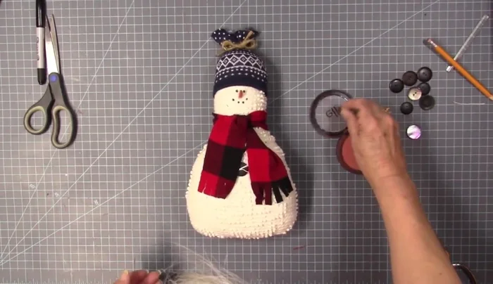 Add blush for rosy cheeks (optional).