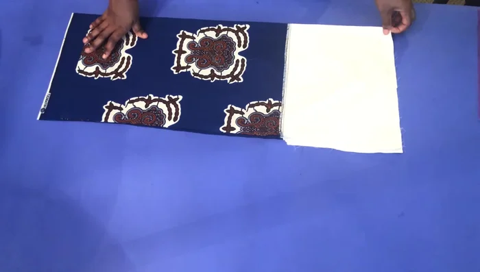 Create a small slit on the back piece, pull the front back, and measure 1 1/4 inches at the back before cutting.