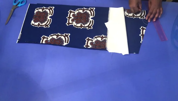 Pull the front piece back to the back, fold the back, and pin it down.