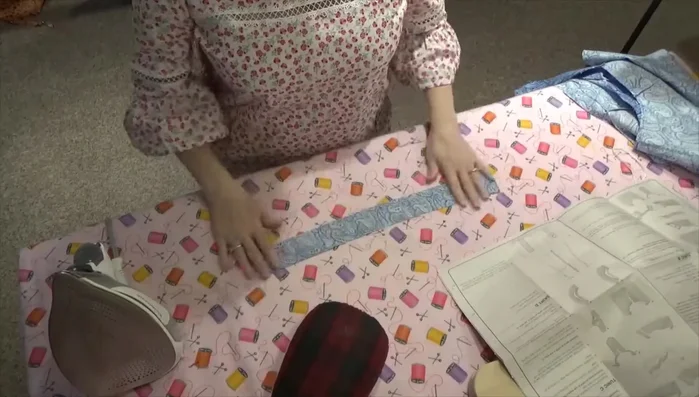 Attach the neck facing, matching notches, and press.