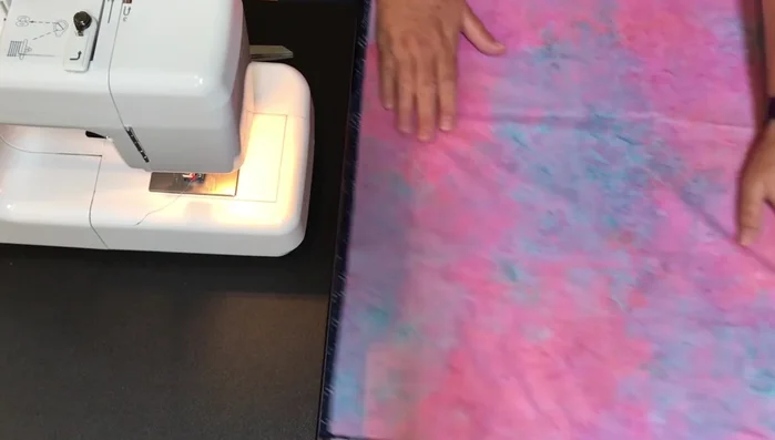 Sew Long Sides: Sew down each long side of both fabric pieces, leaving the short ends unsewn. Use a ¼ inch seam allowance and double stitch at each end for extra durability.