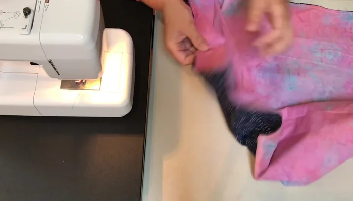 Create the Tube: With wrong sides facing, you now have two fabric tubes. Open one end of one tube and reach into the center. Pull the far end of the fabric through the center, turning it inside out, until both ends meet.