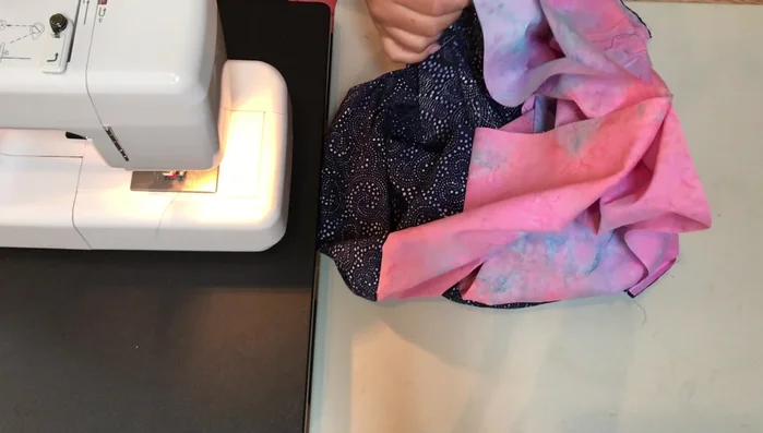 Pin and Sew Opening: Pin around the opening where the two fabric ends meet, matching the colors. Leave a 5-6 inch opening for turning the scarf right side out.