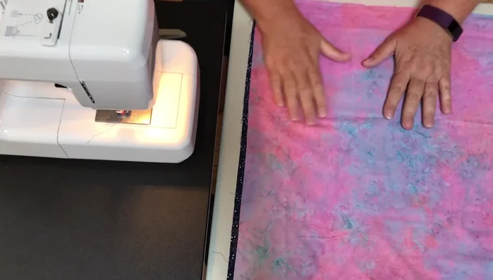 Prepare Fabric: Cut two 64 inches long x 22 inches wide pieces of fabric. If your fabric isn't wide enough, sew together smaller pieces to achieve the desired size (as shown in the video).