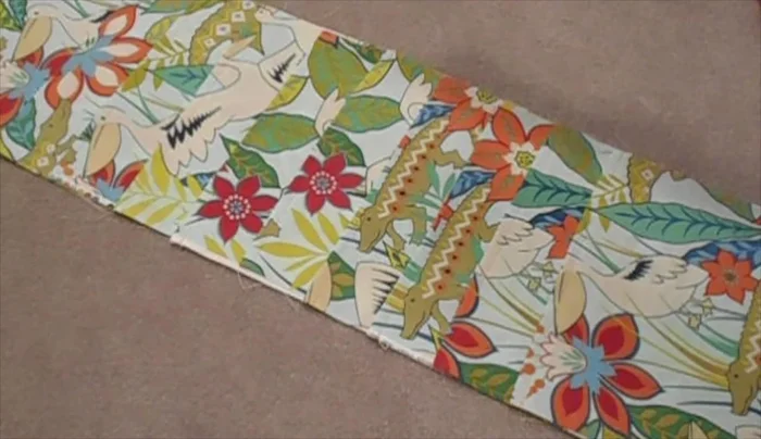 Sew along each side edge of the organizer (about 1/4 inch or 3/8 inch from the edge) to secure the sides to the back panel.