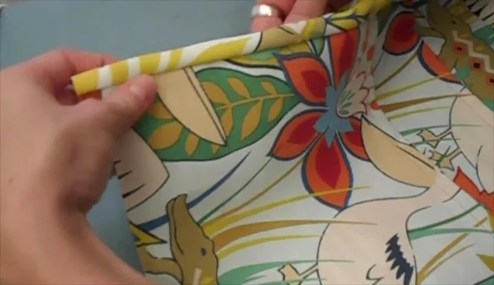 Flip the other side of the binding over, wrap it around the back, and sew about 1/8 inch from the edge of the front of the binding.