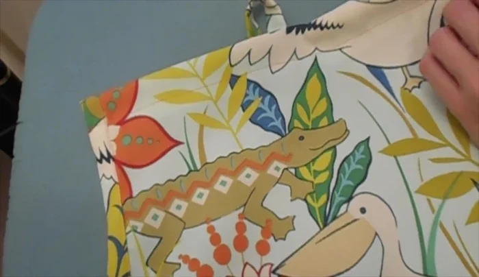 Slide the wooden dowel through the top tunnel.