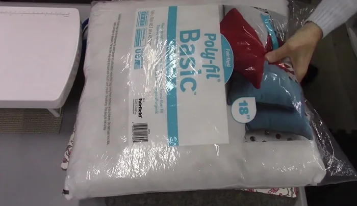 Insert pillow form: Insert the pillow form into the pillow cover. 