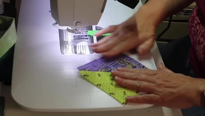 Sew HSTs together in an accordion-like fashion.