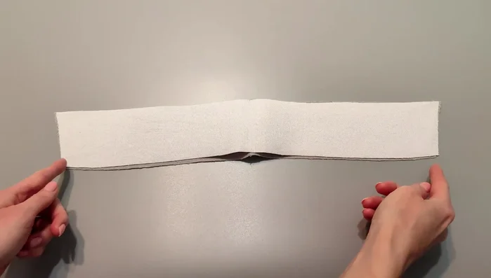 Make the collar: Place the undercollar on the top collar and stitch along the short sides and collar roll line. Turn out and press. Top stitch along the collar.