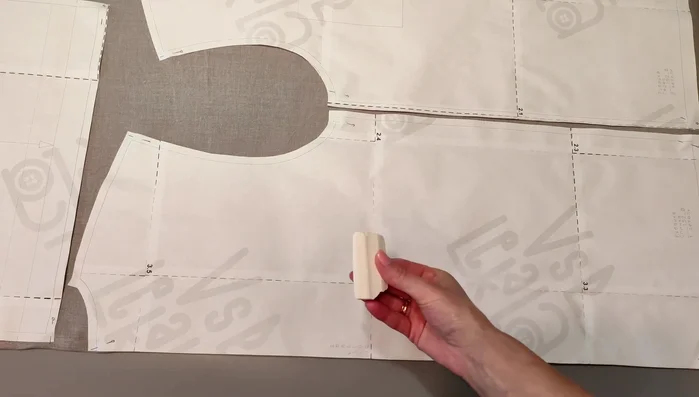 Cut the fabric: Lay out the pattern pieces on the fabric, following the grain line. Transfer all markings onto the fabric before cutting.