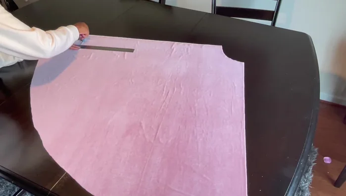 Attach the tulle ruffles to the skirt. Place the ruffles on the marked lines and sew along the center of the ruffles, directly above your initial stitching.