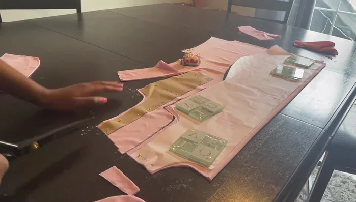 Cut out the back piece, front pieces, and mesh piece using a rotary cutter.