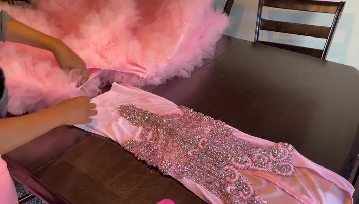 Hand sew a row of ruffles on top of the skirt seam.