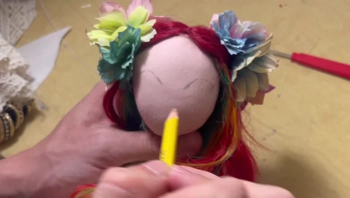 Finishing touches: Stitch down fingertips, add final details.