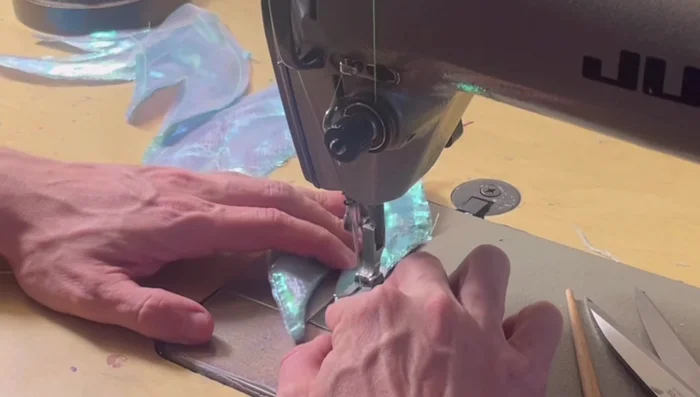 Turn the tail inside out, topstitch the edges of fins and the main tail.