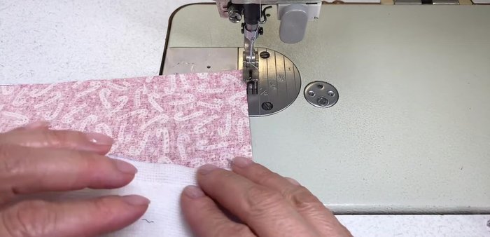 Cut small notches at the halfway mark of the folded fabric.