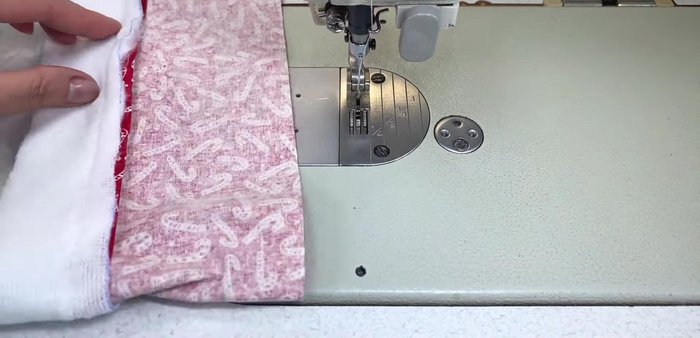Cut small notches at the halfway mark of the folded fabric.