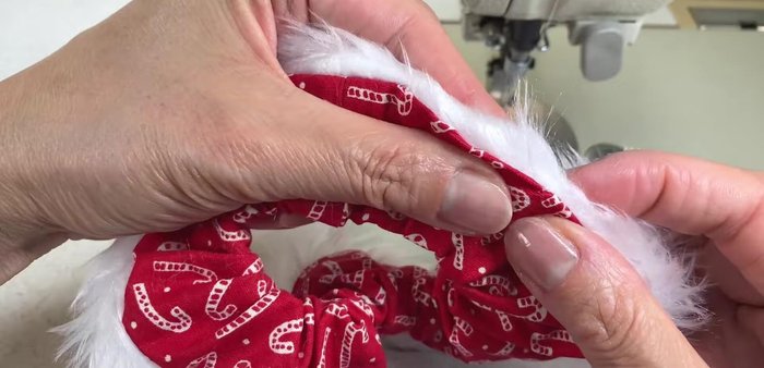 Hand stitch the opening closed using a slip stitch, catching both fur backing and fabric folds.