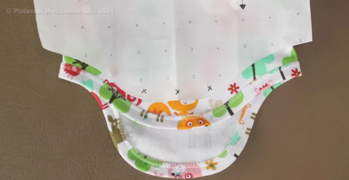 Attach snaps: Position snaps according to the marked Xs on the pattern. Use a hammer and/or snap fastener tool to attach the socket to the back and the stud to the front.