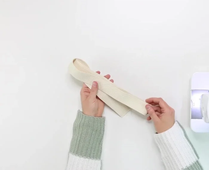 Make an adjustable strap.