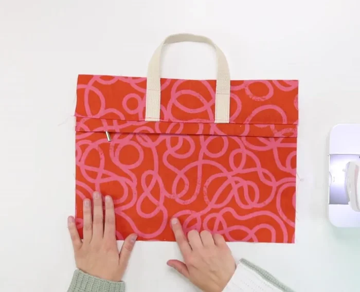 Make an adjustable strap.