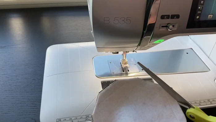 Turn the coaster right side out through the gap. Gently poke out each corner to make them sharp.