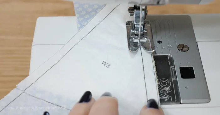 Remove the paper backing by carefully pulling or using tweezers. Spritzing with water can help.