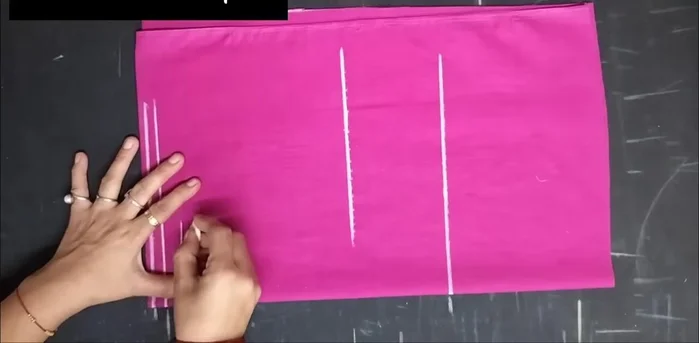 Shape the sleeve using a French curve and a ruler, ensuring the inner curve is deeper for a better fit.