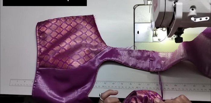 Finish the armhole stitching.