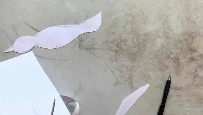 Cut out the paper bird template.