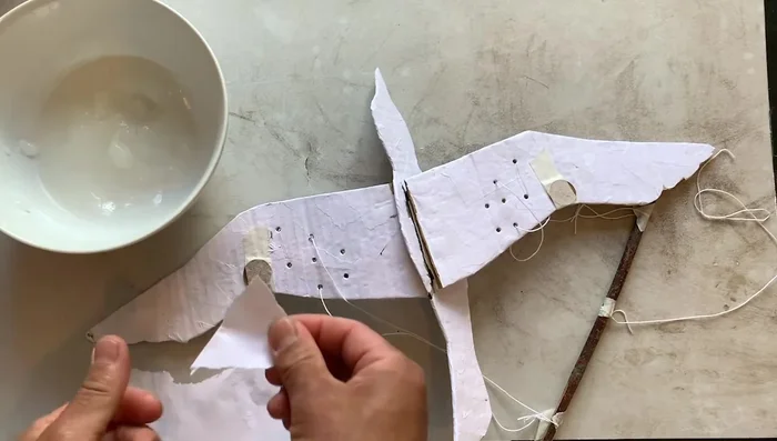 Decorate the bird using paint, colored paper, markers, or colored pencils. (The video shows an example using markers and colored pencils to decorate the bird.)